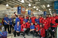 Officeworks Albury team members join TDC riders at the Albury store.